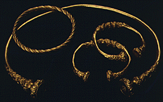 Detail -- ends of torc and two open bracelets